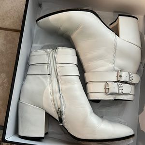 White booties with studded buckles